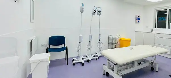 Clean and modern treatment room at Capital Hair Restoration’s Harley Street clinic with medical equipment and examination bed